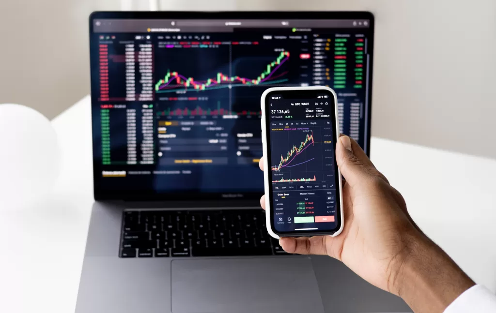 Stock charts on mobile and desktop, dividend stocks
